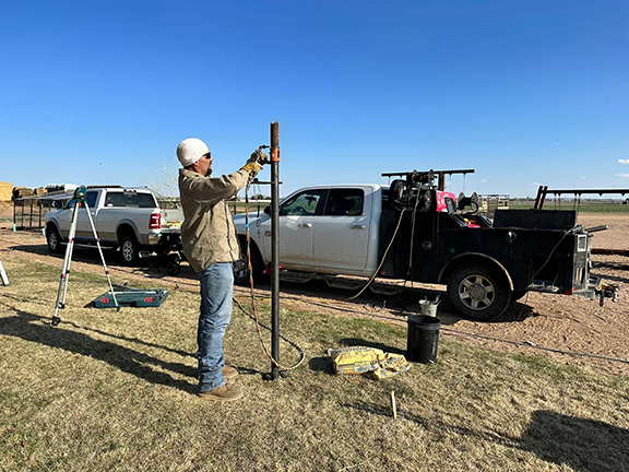 Custom Fabricated Clothes Line Constructed from 2 3/8" Drill Stem Pipe. The posts have been cut, and now for the top. Construction by Integrity Welding Service LLC, servicing the Front Range of Colorado.