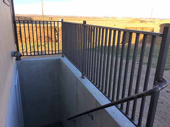 Custom Hand Rails and Stairs, Simple yet Classic design with 1" 1/4" Square Rails with Rec Tubing top, with 1.66" Handrail down the steps. Installed By Integrity Welding Service LLC, servicing the Front Range of Colorado.