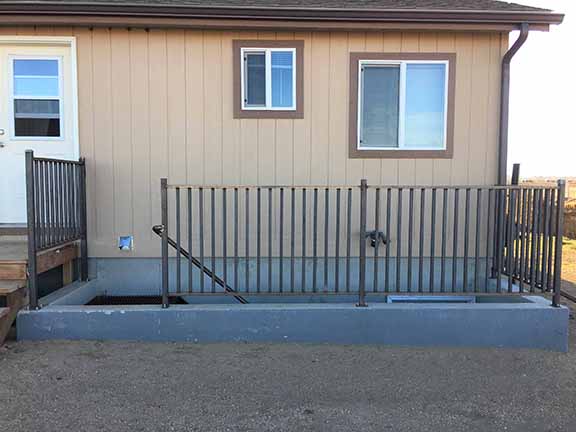 Custom Hand Rails and Stairs, Simple yet Classic design with 1" 1/4" Square Rails with Rec Tubing top. Installed By Integrity Welding Service LLC, servicing the Front Range of Colorado.