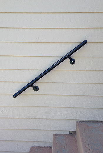 Custom Onsite Pipe Handrail Installed on the House for the Steps. Installed Onsite By Integrity Welding Service LLC, servicing the Front Range of Colorado.