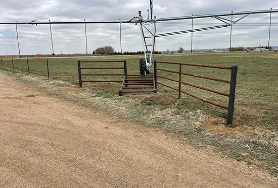 Custom Design and Fabrication 2 3/8" Drill Stem with 4 1/2" Posts Tyting into the Barbwire Fence. Installed By Integrity Welding Service LLC, servicing the Front Range of Colorado.