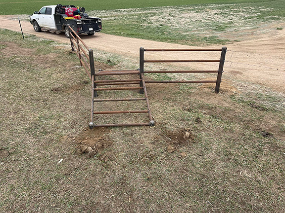 Custom Design and Fabrication 2 3/8" Drill Stem with 4 1/2" Posts Tyting into the Barbwire Fence. Installed By Integrity Welding Service LLC, servicing the Front Range of Colorado.