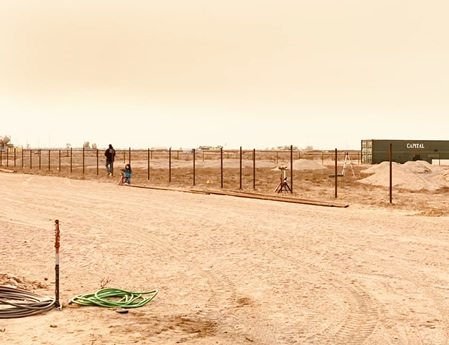 Pipe and Cable Fencing for a Riding Arena construction setting the posts by Integrity Welding Service LLC, servicing the Front Range of Colorado.