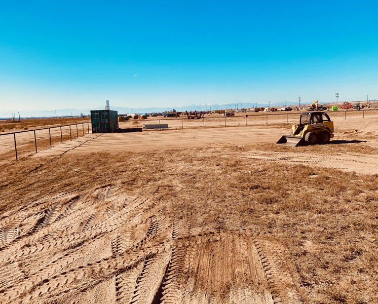 Pipe and Cable Fencing for a Riding Arena, sand footing is being laid out during construction by Integrity Welding Service LLC, servicing the Front Range of Colorado.