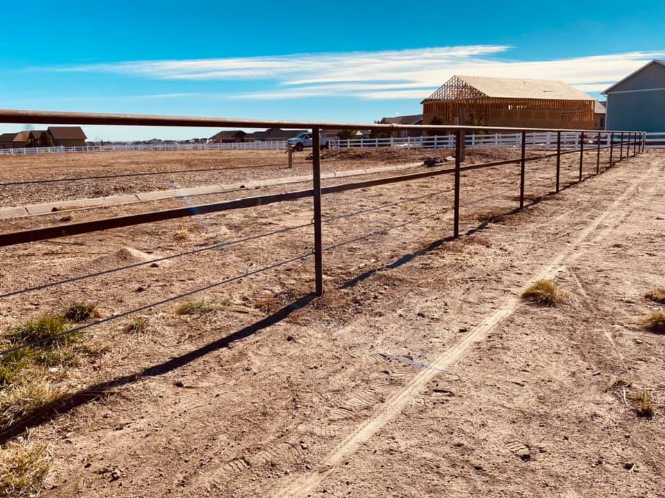 Pipe and Cable Fencing makes Great Fence for Corrals and Perimeter Fencing. 3 Strands of Galvanized Cable and a Rubrail. Constructed by Integrity Welding Service LLC, servicing the Front Range of Colorado.